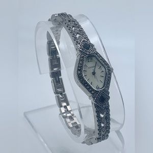 Vintage ladies Elgin quartz; black onyx and marcasite watch with pearl dial.